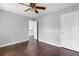 Bedroom featuring wood floors, ceiling fan, and white walls at 274 Westchester Club Dr, Hiram, GA 30141