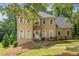 Charming two-story home featuring a stone accent wall and well-manicured landscaping at 274 Westchester Club Dr, Hiram, GA 30141