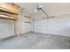 Spacious two car garage with ample storage space and a functional overhead shelving unit at 274 Westchester Club Dr, Hiram, GA 30141