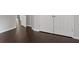 Hallway features dark wood floors, white trim, and closet with paneled doors at 274 Westchester Club Dr, Hiram, GA 30141