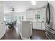 Eat-in kitchen featuring white cabinets, a stainless steel refrigerator, and a breakfast nook at 274 Westchester Club Dr, Hiram, GA 30141