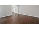Bright living room with dark wood floors, white columns, and arched entryway at 274 Westchester Club Dr, Hiram, GA 30141