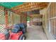 Covered patio featuring a lattice privacy screen and space for outdoor storage and lawn equipment at 274 Westchester Club Dr, Hiram, GA 30141