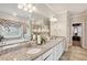 Bathroom featuring double sinks, a granite countertop, and a soaking tub and shower at 244 Lotus Cir, Mcdonough, GA 30252