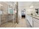Elegant bathroom with a glass-enclosed shower and double vanity, offering a spa-like experience at 244 Lotus Cir, Mcdonough, GA 30252