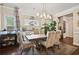 Elegant dining room with chandelier, large table, and ample seating for Gathering and guests at 244 Lotus Cir, Mcdonough, GA 30252