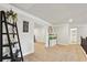 Open hallway with neutral tones, fish tank, and decorative ladder with access to other rooms at 244 Lotus Cir, Mcdonough, GA 30252
