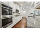 Kitchen showcasing stainless steel appliances, modern cabinets and granite countertops at 244 Lotus Cir, Mcdonough, GA 30252