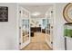 Inviting living room showcased through open French doors, featuring tasteful decor at 244 Lotus Cir, Mcdonough, GA 30252