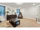 Cozy living room with elegant decor, comfortable seating, and warm, neutral tones at 244 Lotus Cir, Mcdonough, GA 30252