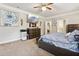 Bedroom featuring a comfortable bed, dresser, and mounted TV, offering a relaxing retreat at 244 Lotus Cir, Mcdonough, GA 30252