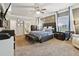 Spacious bedroom with plush carpeting, large windows, and contemporary decor at 244 Lotus Cir, Mcdonough, GA 30252
