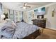 Spacious bedroom with decorative wall art, ceiling fan and flat screen television at 244 Lotus Cir, Mcdonough, GA 30252