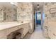 Bathroom with patterned wallpaper, white cabinetry and vanity at 607 Delphinium Nw Blvd, Acworth, GA 30102