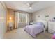 Charming bedroom with a white bed, closet and dresser at 607 Delphinium Nw Blvd, Acworth, GA 30102