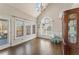 Bright breakfast nook with large windows and a glass door leading to the deck at 607 Delphinium Nw Blvd, Acworth, GA 30102