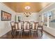Dining room featuring hardwood floors, a chandelier, and a gold leaf ceiling at 607 Delphinium Nw Blvd, Acworth, GA 30102
