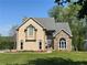 Charming two-story home featuring stone accents, manicured lawn and a welcoming front entrance at 607 Delphinium Nw Blvd, Acworth, GA 30102