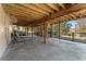 Expansive covered outdoor patio featuring an open design and black metal fence, offering a relaxing space for outdoor living at 607 Delphinium Nw Blvd, Acworth, GA 30102