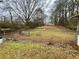 Fenced backyard is ready for entertaining or gardening at 733 Linda Way, Forest Park, GA 30297