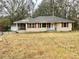 Charming single-Gathering home showcases its well-kept front lawn and classic design in a peaceful neighborhood at 733 Linda Way, Forest Park, GA 30297