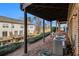 View of the exterior back patio with natural sunlight, green foliage and the building's AC units at 2722 Hallwood Ln, Suwanee, GA 30024