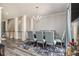 Elegant dining room boasting a chandelier, neutral walls, and wood-look floors at 2722 Hallwood Ln, Suwanee, GA 30024