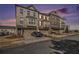 Beautiful townhome exterior with brick facade, attached garages and lovely landscaping at 2722 Hallwood Ln, Suwanee, GA 30024
