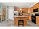 Well-equipped kitchen featuring wood cabinets, stainless steel appliances, and a functional island at 2722 Hallwood Ln, Suwanee, GA 30024
