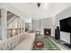 Inviting living room featuring a fireplace, neutral walls, and wood-look floors at 2722 Hallwood Ln, Suwanee, GA 30024