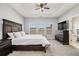 Serene main bedroom featuring tray ceilings, ample natural light, and neutral decor at 2722 Hallwood Ln, Suwanee, GA 30024