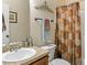 Cozy bathroom featuring a decorative shower curtain and neutral color palette at 28 Butler Park Ct, Dallas, GA 30157