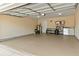 Spacious garage with clean, epoxy-coated floor, storage shelving, and ample parking space at 28 Butler Park Ct, Dallas, GA 30157