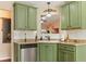 Bright kitchen with stainless steel dishwasher and granite countertops at 28 Butler Park Ct, Dallas, GA 30157