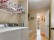 Functional laundry area with washer, dryer, and ample space for storage and organization at 28 Butler Park Ct, Dallas, GA 30157