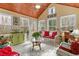 Inviting sunroom with wood ceiling, multiple windows, and stylish decor for relaxation and enjoyment at 28 Butler Park Ct, Dallas, GA 30157