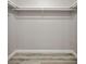 Empty walk in closet features white trim and wood-look flooring at 2995 Clearwater Dr, Douglasville, GA 30135