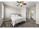 Bedroom featuring neutral walls, ceiling fan, carpeted floors, and a modern en suite bathroom at 714 Opera Ln, Alpharetta, GA 30009