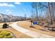 Encore Park community entrance and sidewalk surrounded by lush landscaping at 714 Opera Ln, Alpharetta, GA 30009