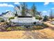 Inviting community entrance with decorative landscaping, stone accents, and the 'Serenade' community sign at 714 Opera Ln, Alpharetta, GA 30009