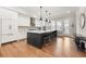 Bright kitchen features a large island with seating, stainless appliances, and ample counter space at 714 Opera Ln, Alpharetta, GA 30009