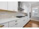 Elegant kitchen features subway tile backsplash, stainless steel appliances, and white cabinets at 714 Opera Ln, Alpharetta, GA 30009