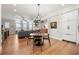 Open-concept living area featuring hardwood floors, modern lighting, and a comfortable gray sofa at 714 Opera Ln, Alpharetta, GA 30009