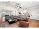 Bright living room features hardwood floors, an exposed staircase, and stylish furnishings at 714 Opera Ln, Alpharetta, GA 30009