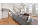 Bright living room features hardwood floors, an exposed staircase, and stylish furnishings at 714 Opera Ln, Alpharetta, GA 30009
