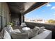 Comfortable covered patio featuring neutral outdoor seating, ceiling fan, and neighborhood views at 714 Opera Ln, Alpharetta, GA 30009