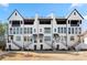 Charming new construction townhomes feature brick exteriors, private balconies, and landscaped front yards at 714 Opera Ln, Alpharetta, GA 30009