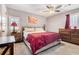 Cozy bedroom with a ceiling fan, natural light, and neutral paint at 1040 Forest East Dr, Stone Mountain, GA 30088