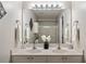 Clean bathroom features a dual sink vanity, large mirror and modern fixtures at 1096 Liberty Nw Pkwy, Atlanta, GA 30318