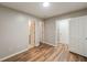 The bedroom has 3 doorways and durable wood look floors at 1096 Liberty Nw Pkwy, Atlanta, GA 30318
